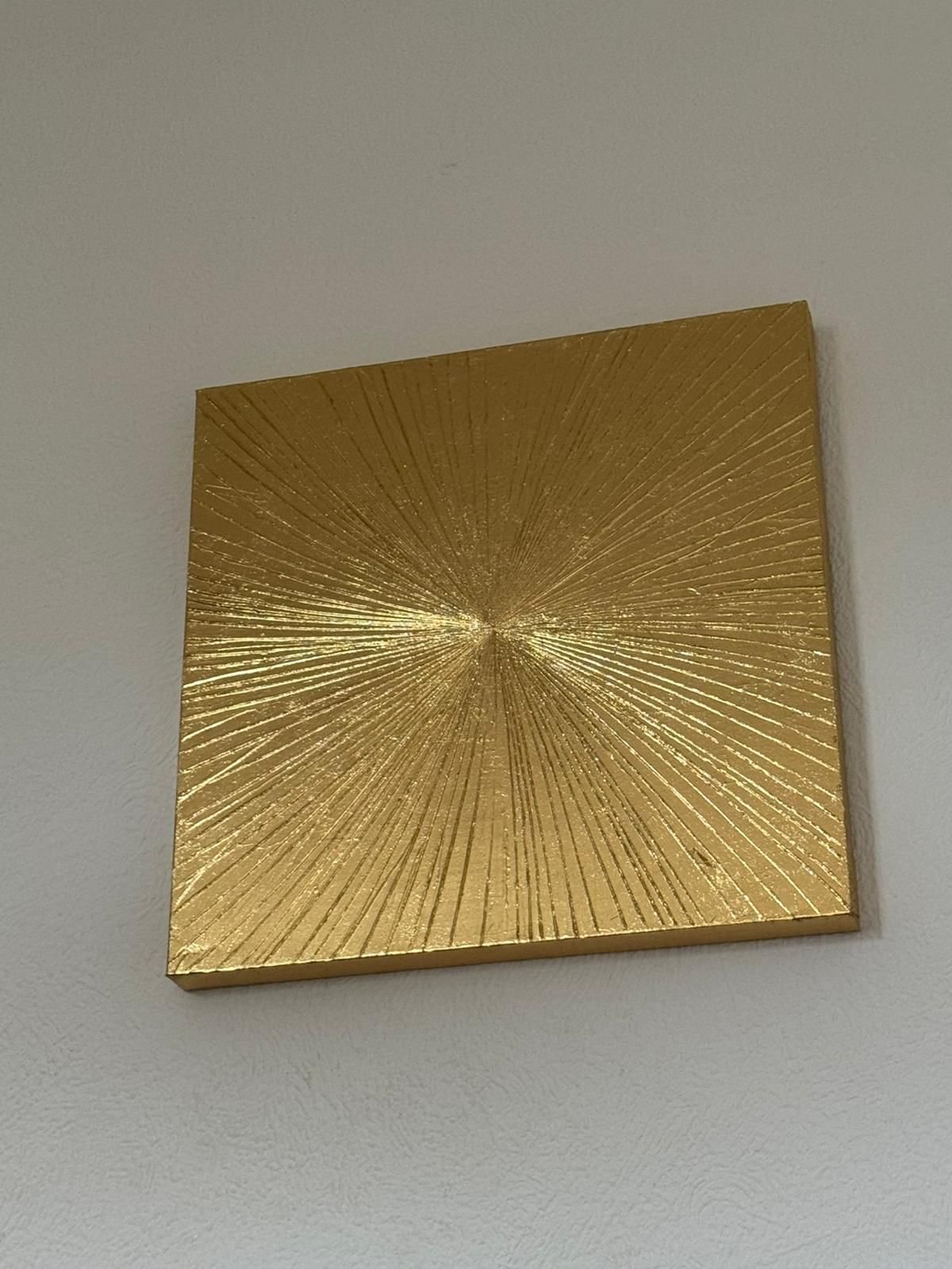 Gold radiating textured artwork